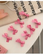 8 Pink Ribbon Bow Hair Clips On The Forehead - Image 6