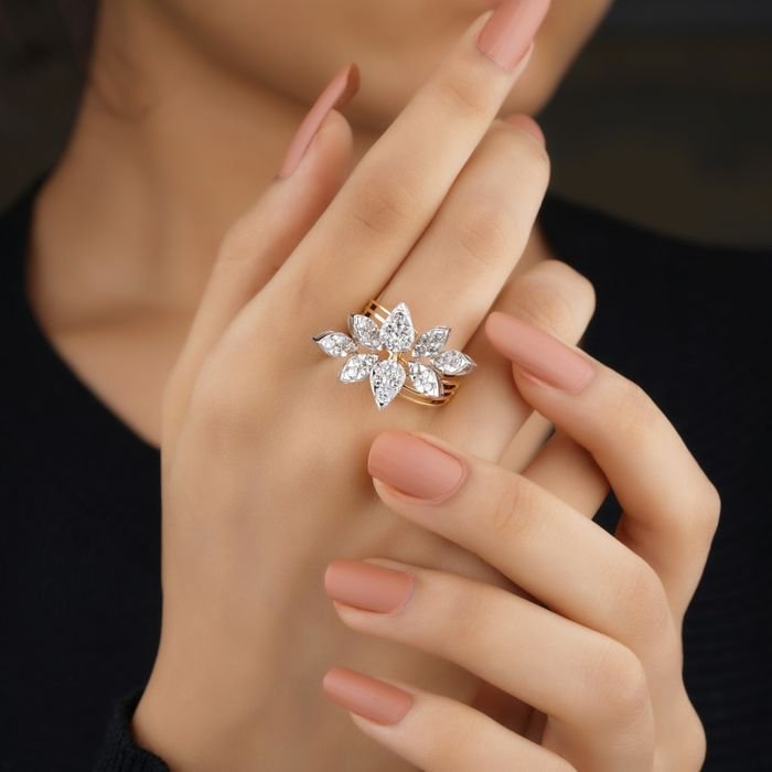 Close-up of a woman's hand wearing a sparkling diamond flower ring, exuding elegance.