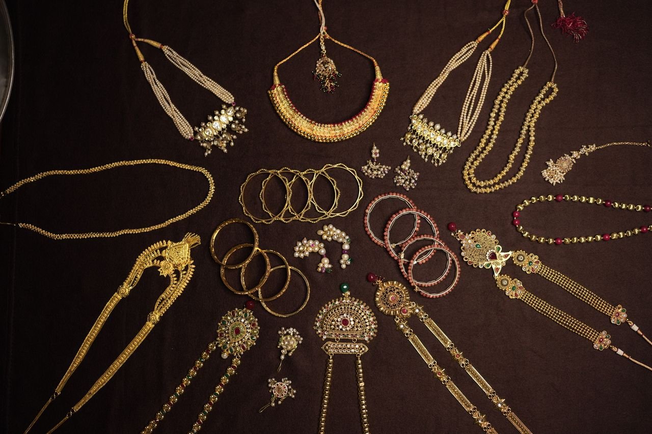 An exquisite display of traditional Indian jewelry including necklaces, bangles, and earrings.